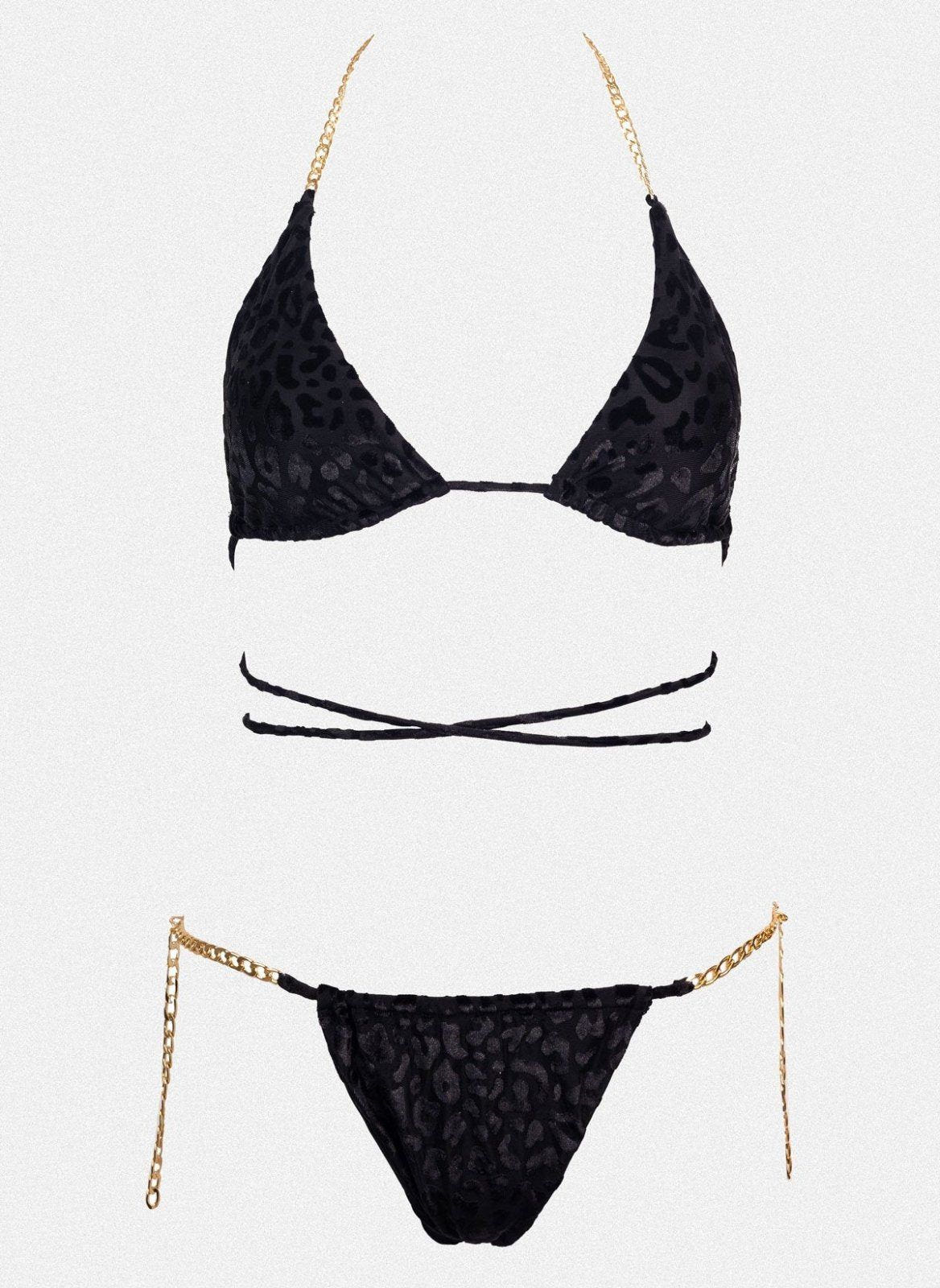 Black triangle bikini top with wrap straps and gold chain side details, matching black bikini bottom laid flat on white