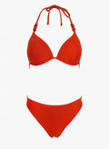 Red underwire halter bikini top with ring details and red bikini bottom, laid flat on white background