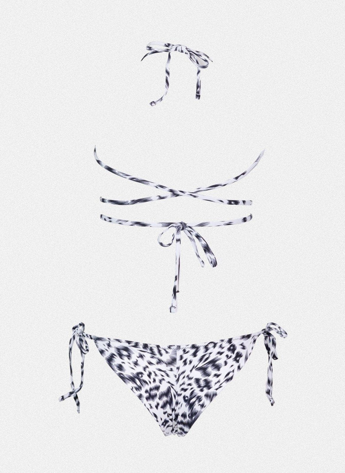 Navy and white leopard print string bikini top with wrap tie and matching side-tie bikini bottom, laid flat on white