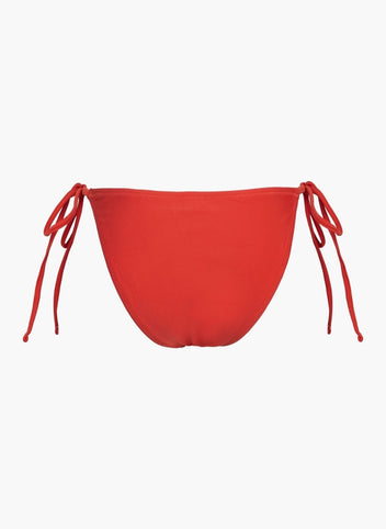 Red side-tie bikini bottom with thin tie straps and high-cut back, laid flat on white background