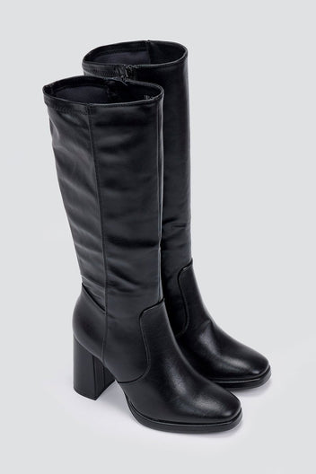 Pair of black knee-high block heel boots with smooth leather shafts and rounded toes, angled view on a light grey backdrop