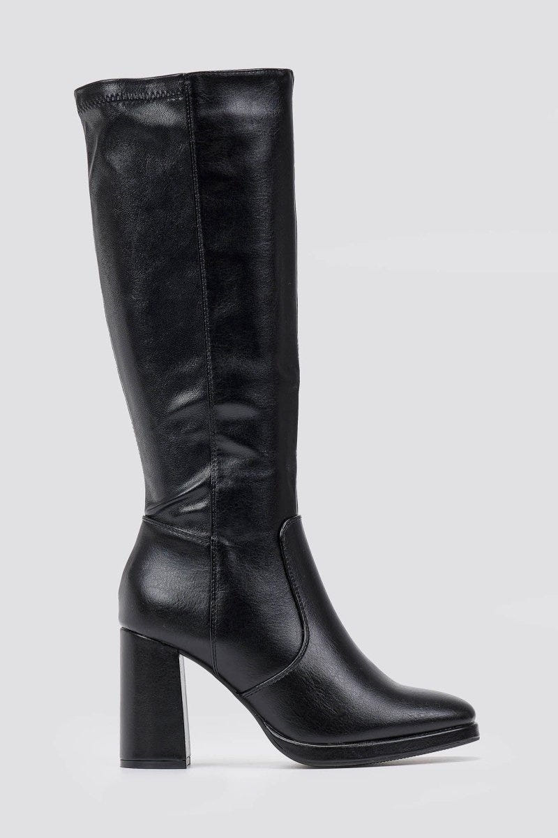 Black knee-high boot with a block heel and smooth leather finish, side view on a light grey backdrop with a slim shaft