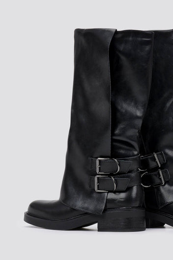 Black leather knee-high boot with two buckle straps at the side and round toe, front view on a light grey background