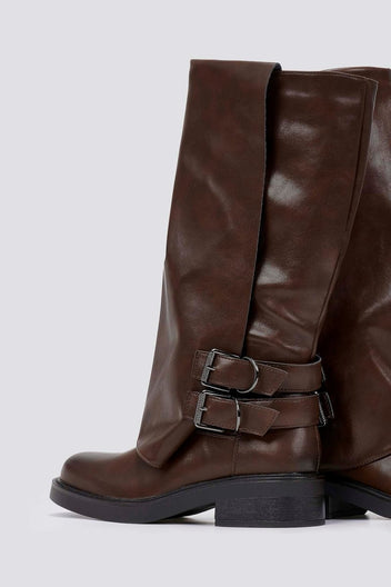 Brown leather knee-high boot with buckle straps and chunky sole, side view on a light grey background