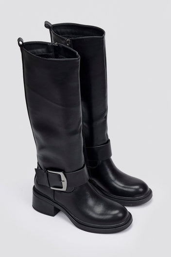 Pair of black leather knee-high biker boots with buckle straps and chunky block heels, angled view on a light grey background