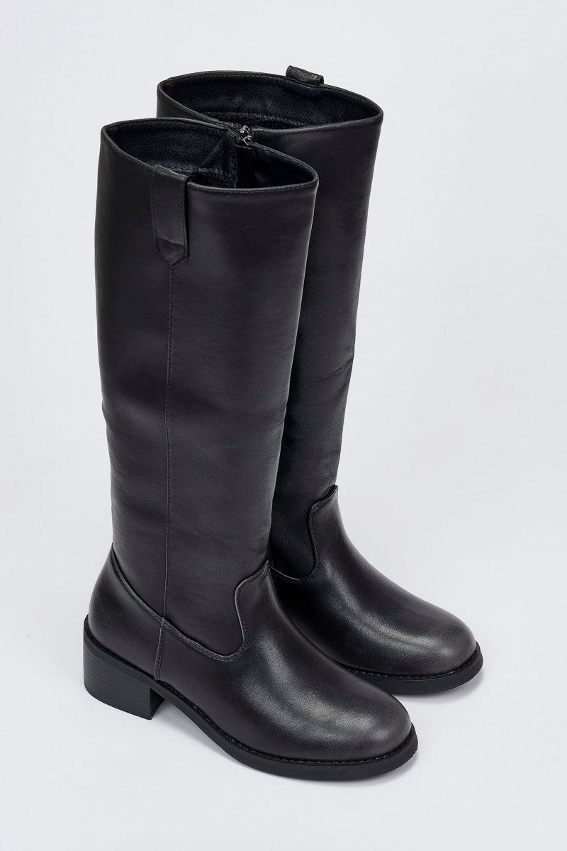 Pair of black leather knee-high boots with round toes and chunky block heels, angled view on a light grey background