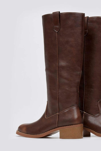 Brown leather knee-high boot with round toe and tan block heel, front view on a light grey background