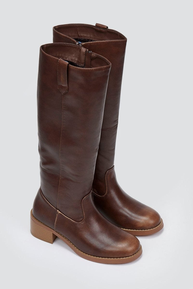 Pair of dark brown leather knee-high boots with round toes and tan block heels, angled view on a light grey background