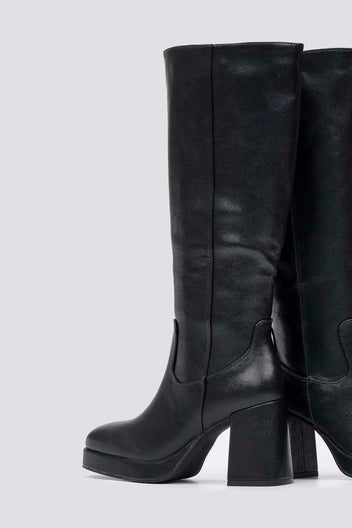 Black knee-high platform block heel boot with side zip, side view on light grey background