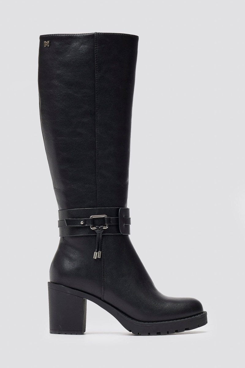 Black leather knee-high block heel boot with buckle strap and side zip, side view on a light grey background
