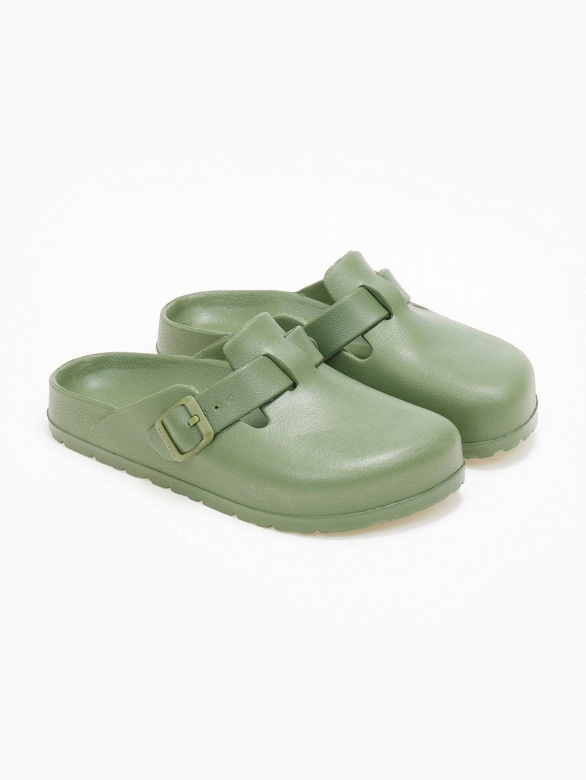Pair of sage green rubber clogs with buckle straps, overhead angled view on a white background