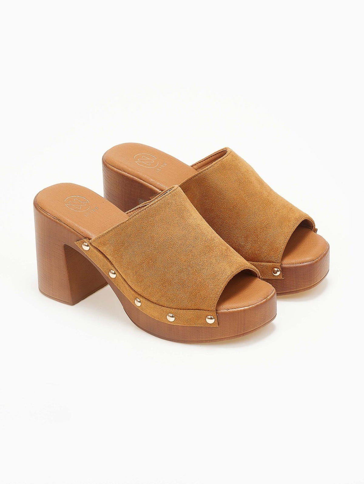 Pair of tan suede block heel slides with wooden-look platform and open toes, angled view on a white background