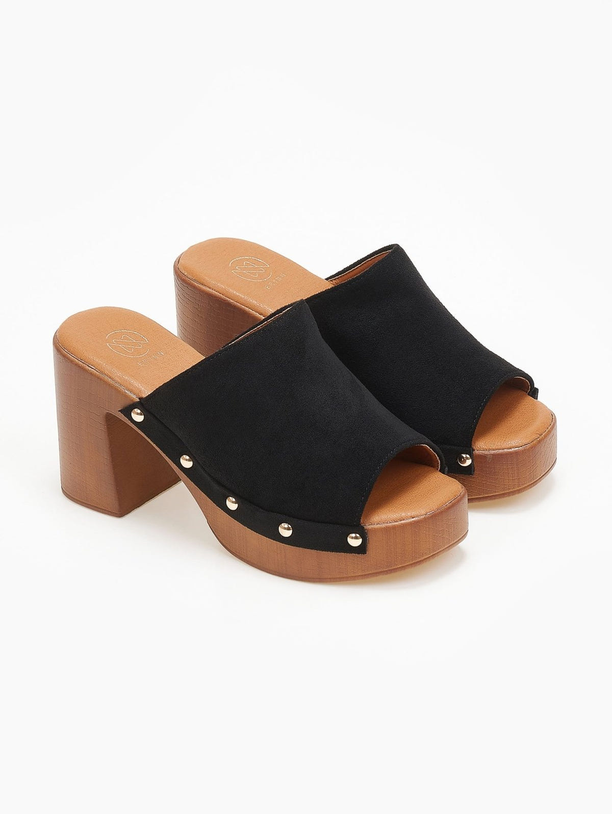 Pair of black suede block heel slides with open toes, gold studs and wooden-look platform, angled view on a white background