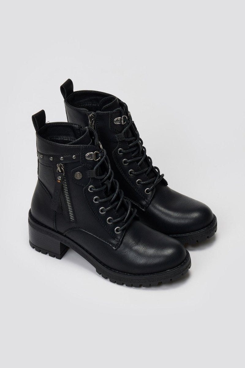 Pair of black leather lace-up ankle boots with chunky block heels, side studs and buckle detail, angled view on light grey