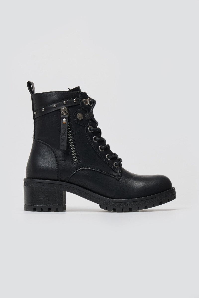Black leather lace-up combat ankle boot with chunky block heel and side zip, angled view on a light grey background