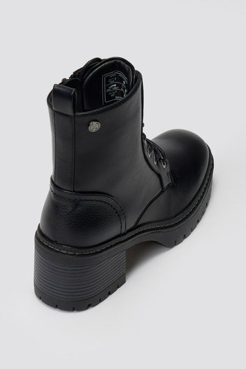 Black leather lace-up ankle boot with chunky lug sole and side zip, angled top view on a light grey background