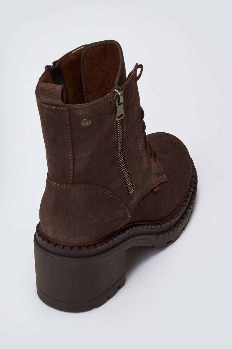 Dark brown suede lace up boot with side zip and block heel, angled top view on light grey background