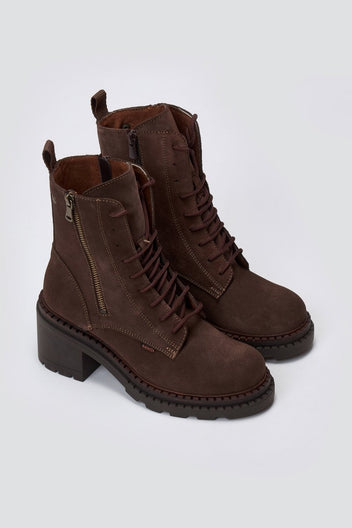 Dark brown suede lace up boots with block heel and chunky sole, angled view on light grey background