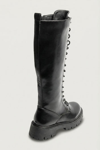 Black leather knee-high lace-up boot with chunky lug sole and side zip, side view on a light grey background