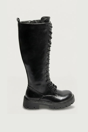 Black leather knee-high lace-up boot with chunky lug sole, angled view on a light grey background