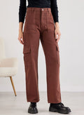 Brown wide leg cargo pants with high waist, button fly, front pockets and side flap pockets, worn on model, front view