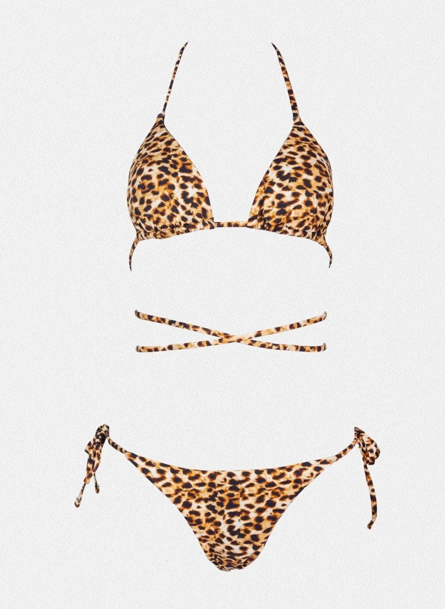 Leopard print triangle bikini top with halter tie and matching side-tie bikini bottom, laid flat on white background