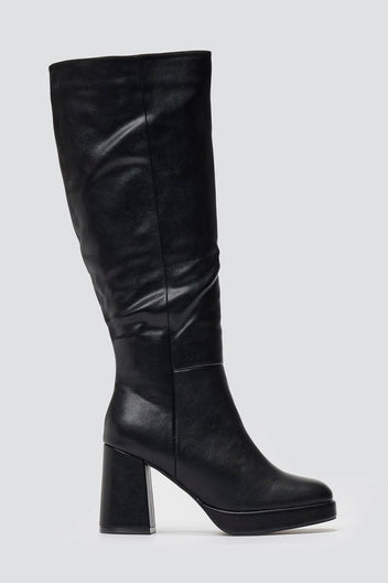 Black leather knee-high platform boot with block heel and slouchy shaft, side view