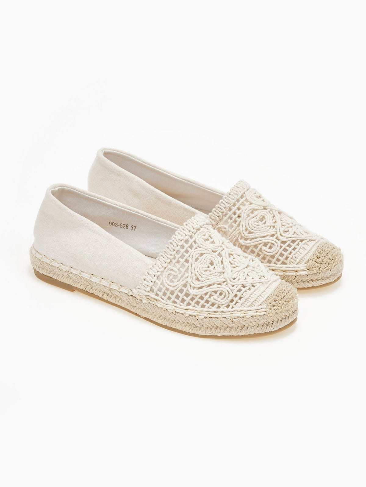 Pair of cream canvas espadrilles with crochet lace vamps and braided jute soles, angled view