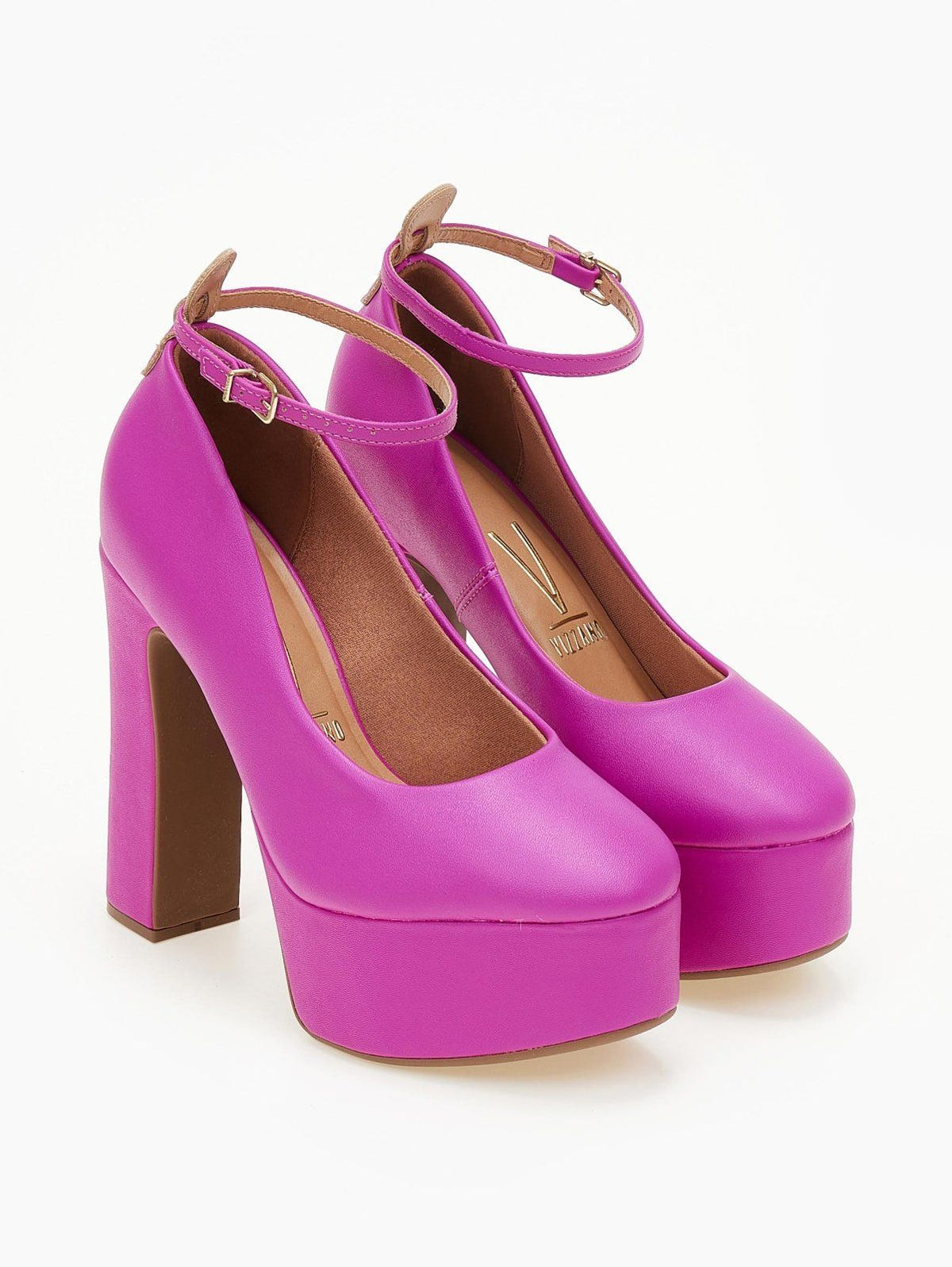 Fuchsia platform pumps with chunky block heel and buckled ankle straps, angled front view of pair.