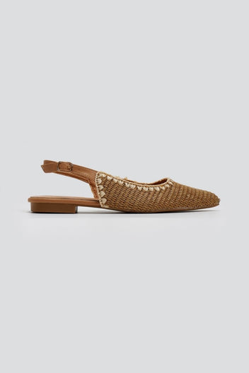 Tan woven raffia pointed toe flat slingback with ankle strap and thin sole, side view