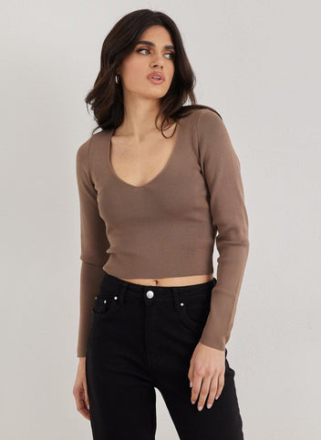 Brown V-neck long sleeve cropped knit top, three quarter front view worn on model
