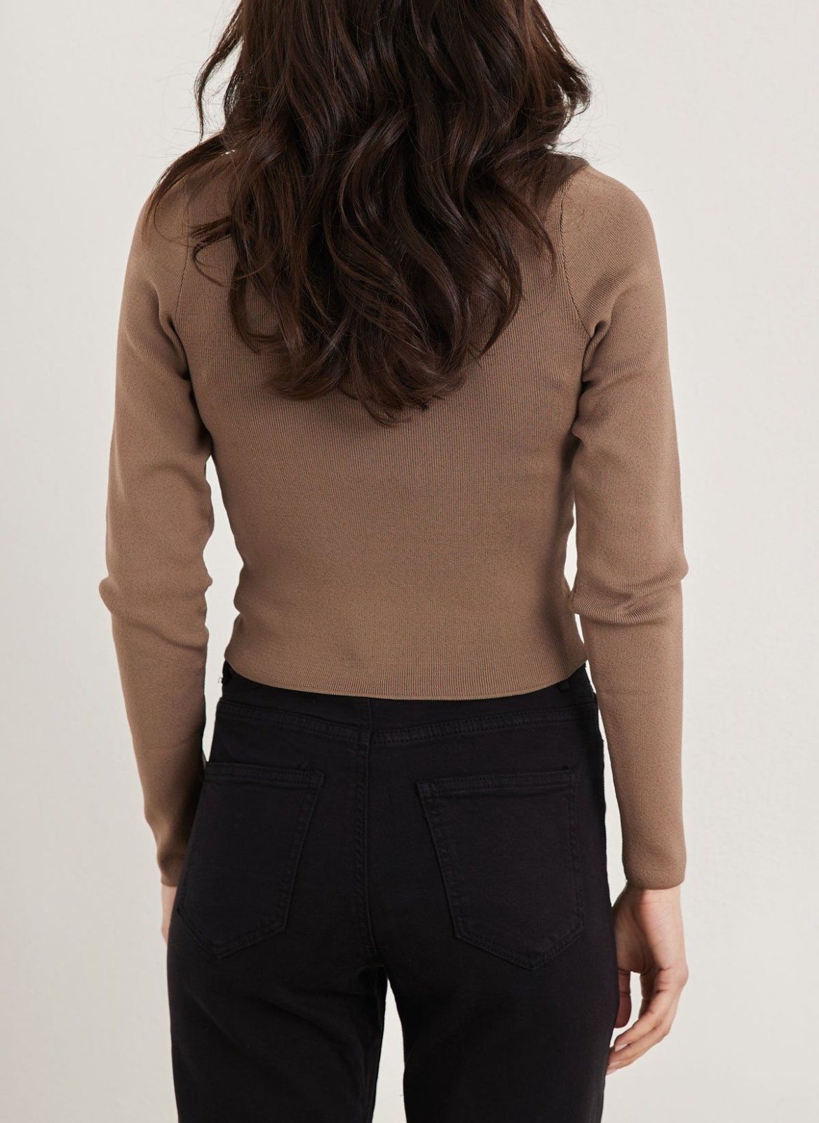 Brown long sleeve ribbed knit top with fitted cropped hem, back view worn on model