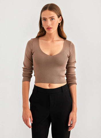 Brown V-neck cropped knit top with long sleeves and fitted cut, front view worn on model