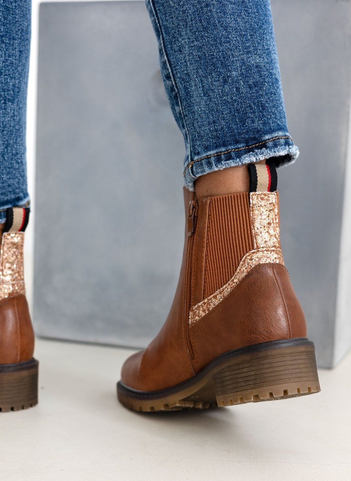 Camel ankle boots with ribbed elastic gusset and gold glitter trim, back view, worn on model