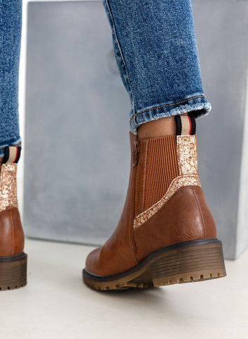 Camel ankle boots with ribbed elastic gusset and gold glitter trim, back view, worn on model