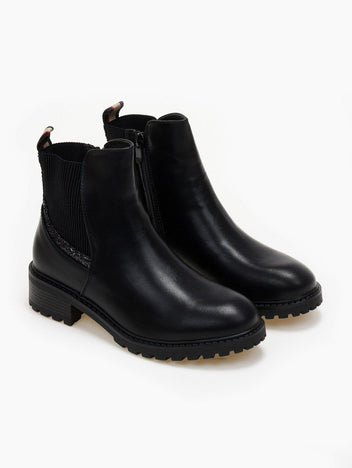 Pair of black ankle boots with elastic side panel, glitter trim, block heel and chunky lug sole, three-quarter view