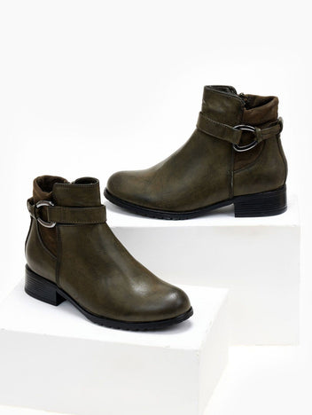 Olive faux leather ankle boots with buckle strap, side zip and low block heel, front view on white blocks