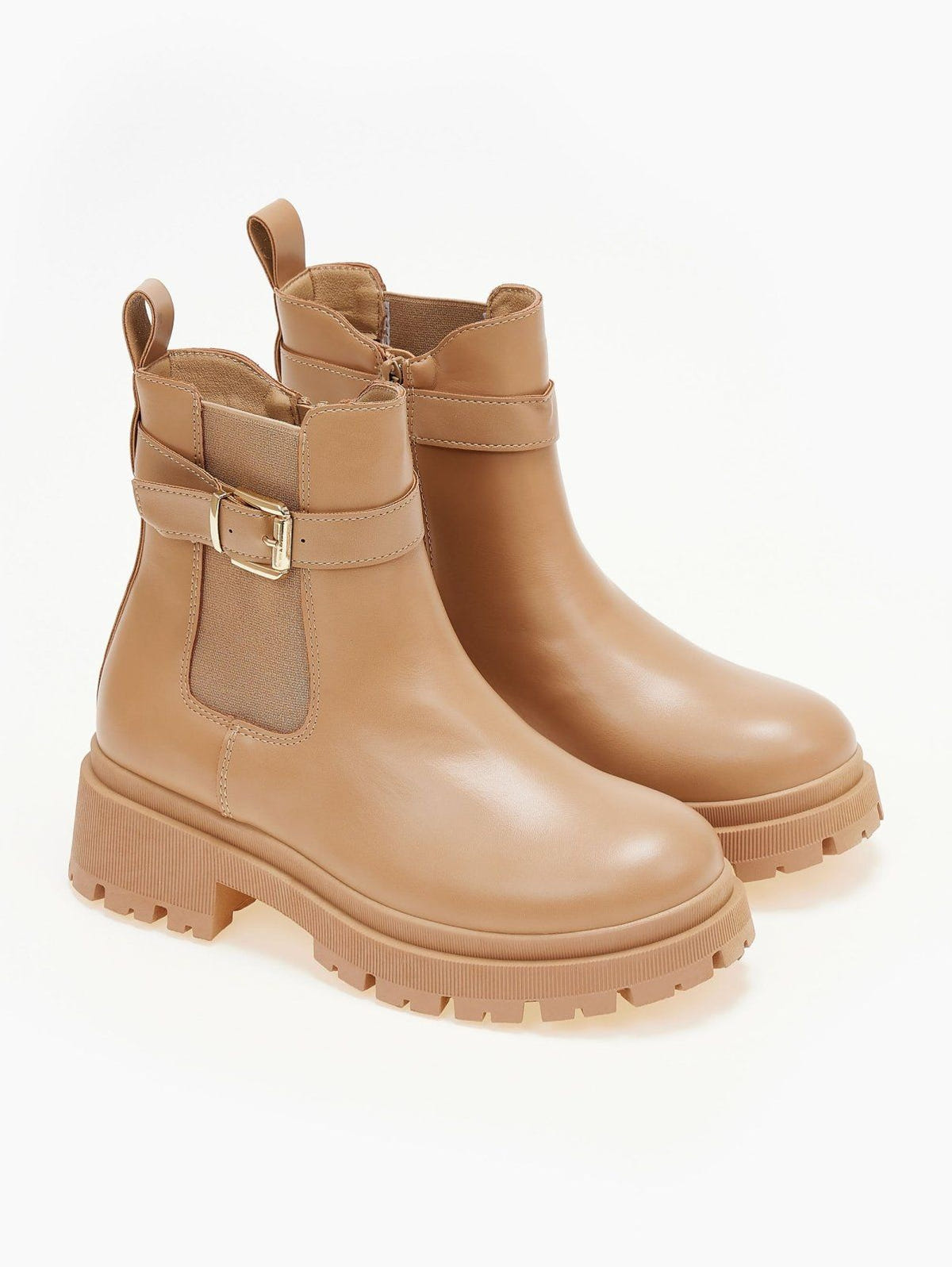 Taupe chunky sole ankle boots with elastic gusset, buckle strap and pull tab, front three-quarter view