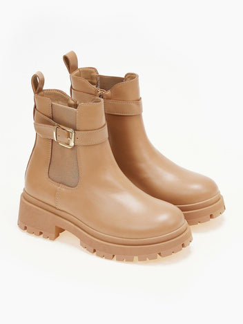 Taupe chunky sole ankle boots with elastic gusset, buckle strap and pull tab, front three-quarter view