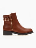 Tan ankle boot with gold metal side zipper, buckle strap and low block heel on black sole, side view