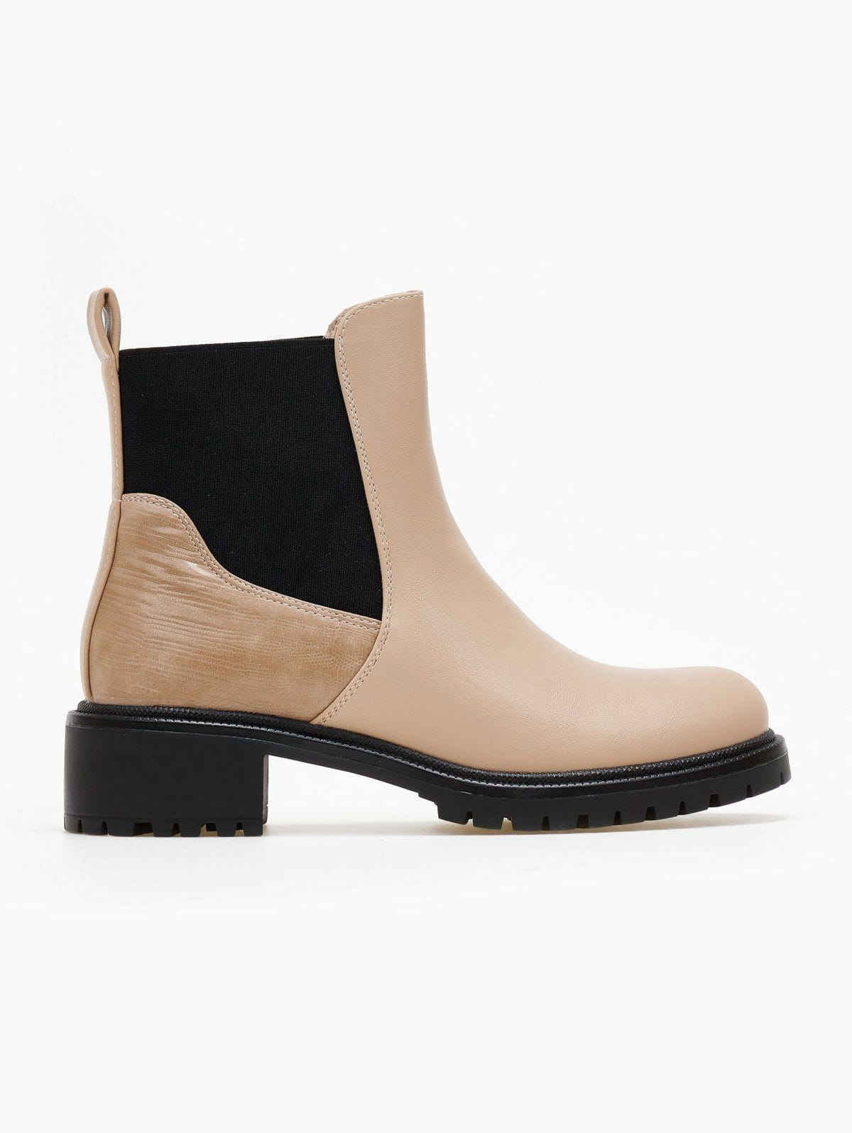 Beige faux leather Chelsea ankle boot with black elastic gusset, embossed heel panel and black lug sole, side view