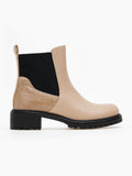 Beige faux leather Chelsea ankle boot with black elastic gusset, embossed heel panel and black lug sole, side view