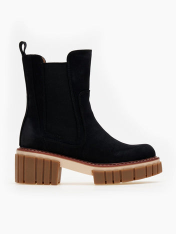 Black suede Chelsea boot with elastic side panel, pull tab and chunky tan lug sole, flat side view on white