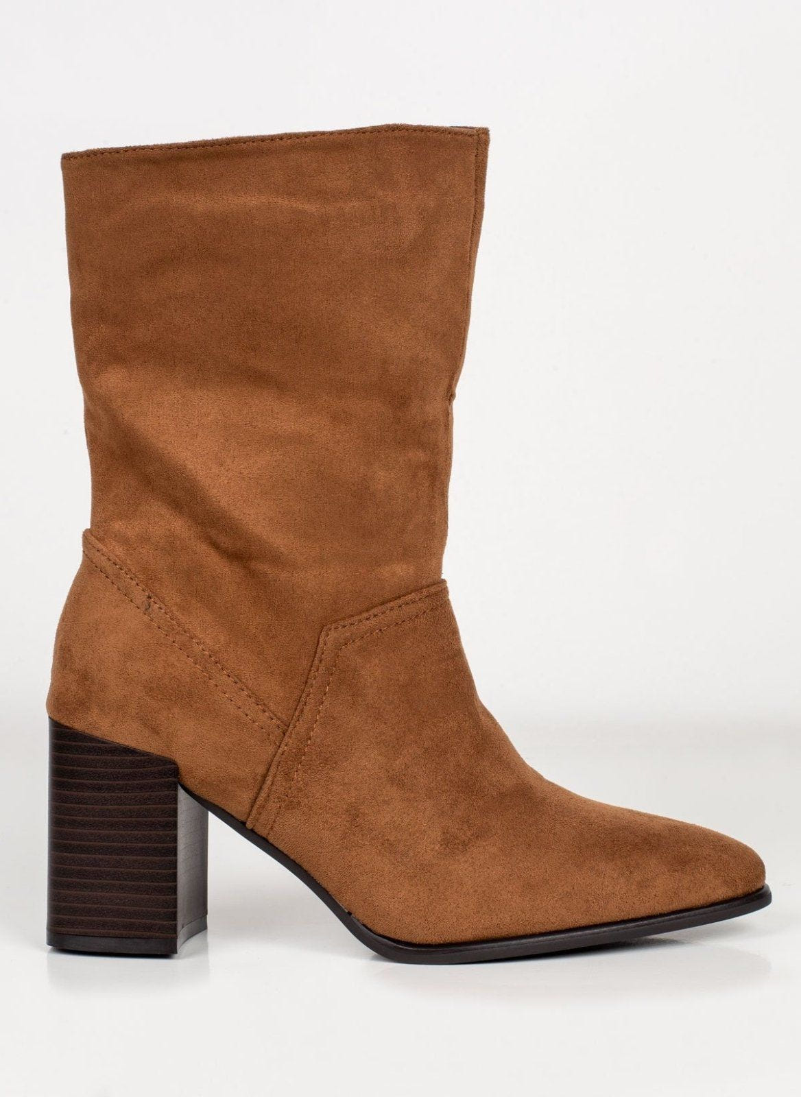 Tan suede block heel ankle boot with slouchy shaft and pointed toe, side view on white background