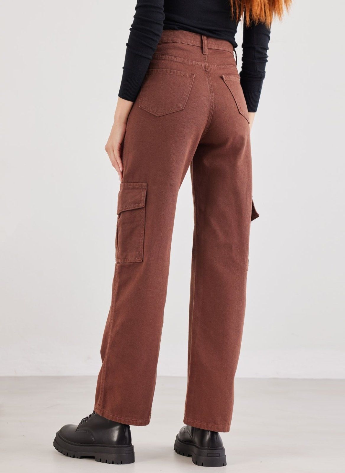 Brown high waist wide leg cargo pants with side pockets and back pocket, back view on model