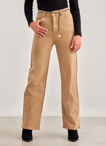 Close-up of beige high waist wide leg jeans with chain detail at the waistband, worn on model, front detail view