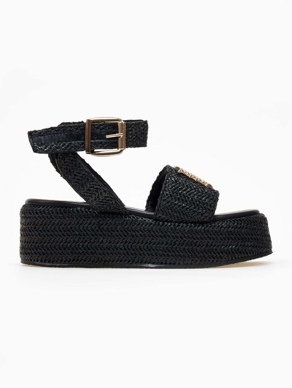 Black woven raffia platform sandal with ankle strap buckle and gold mesh patch, side view