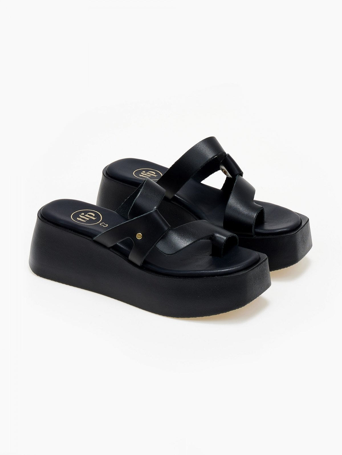 Black leather platform slide sandals with crossover toe loop straps, three-quarter view