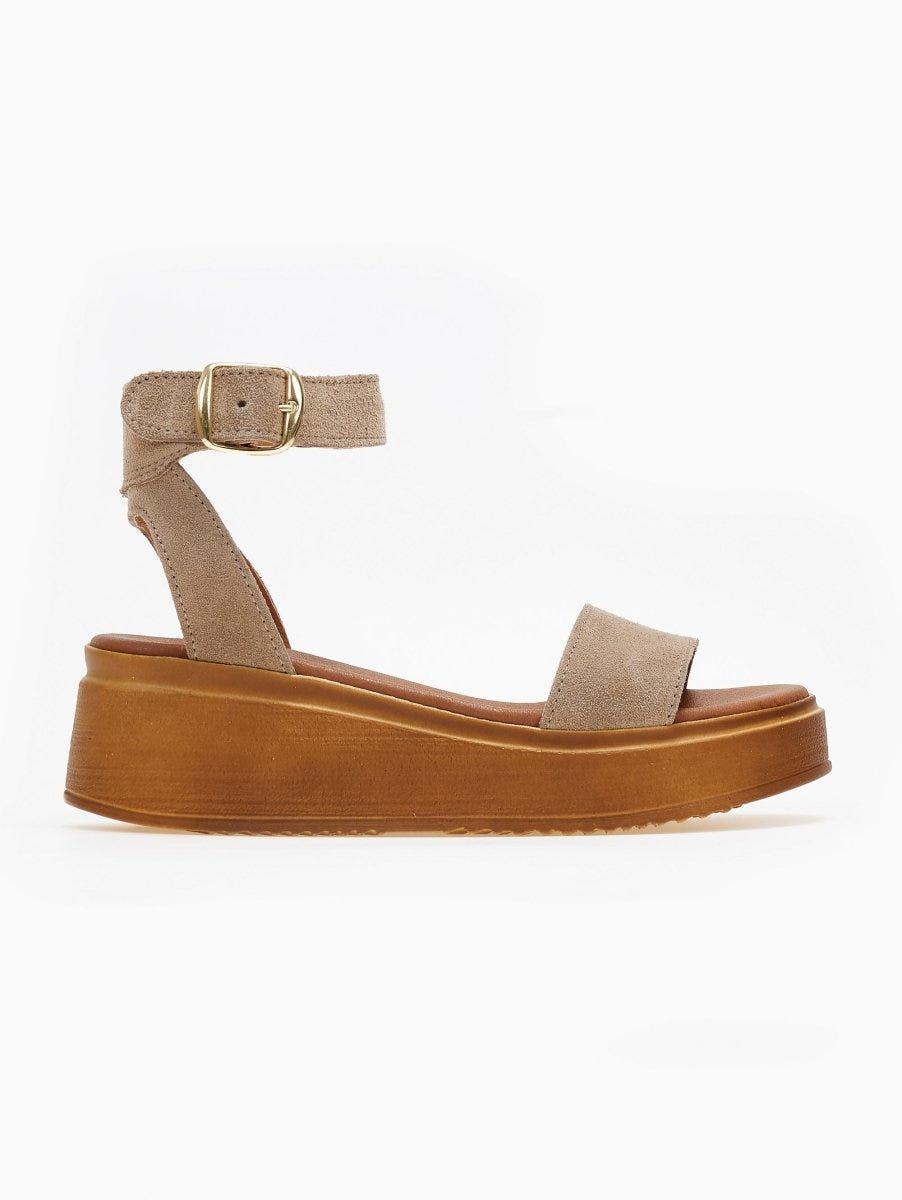 Taupe suede wedge platform sandal with ankle buckle strap and tan cork-style sole, side view