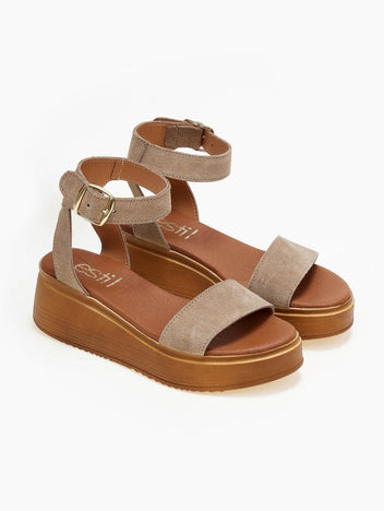 Pair of taupe suede wedge platform sandals with ankle strap and tan sole, three-quarter view